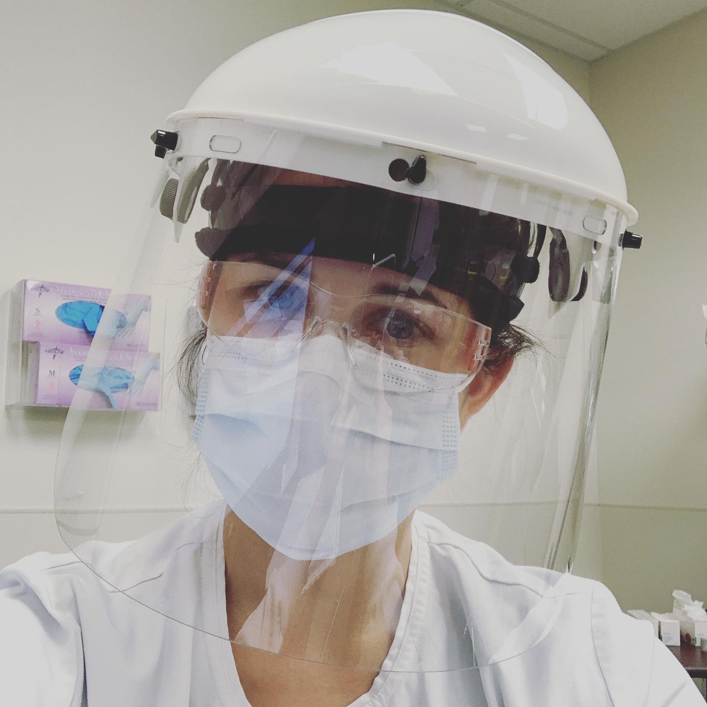 Alumna healthcare worker with faceshield and mask.